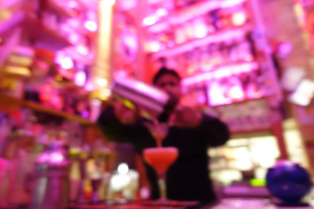 High-end drinks and club culture often set the stage for hidden tensions during girls’ trips. (Credit: Tint Media/Shutterstock)