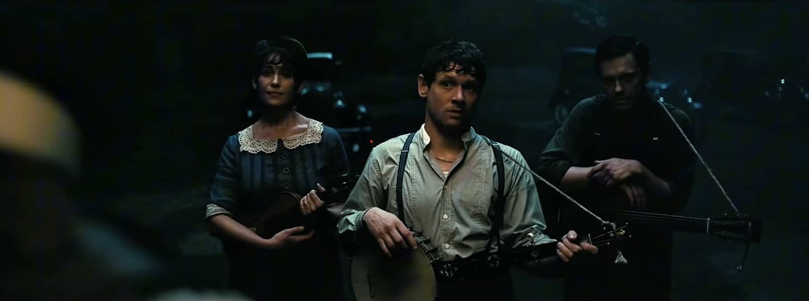 Remmick, Joan, and Bert playing the banjo