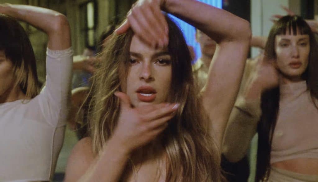 Addison Rae performing in a music video