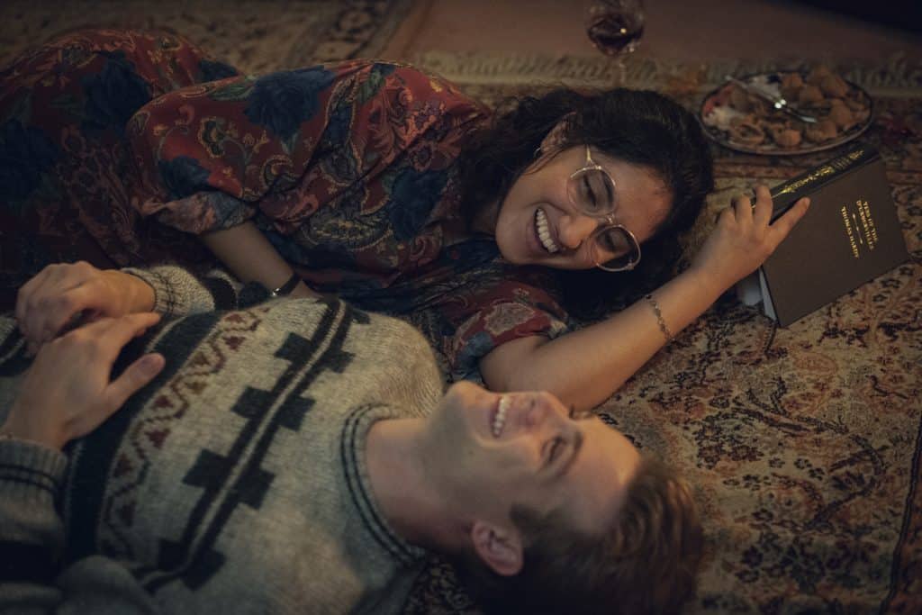 Emma and Dexter share a lay on the floor and share a laugh.
