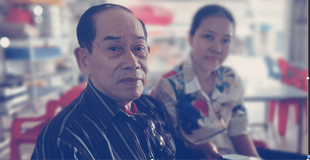 A Vietnamese man and woman sitting together.