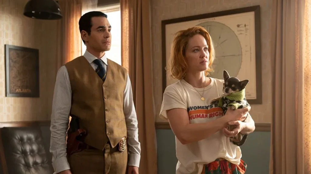 Will Trent (Ramón Rodríguez) and Angie Polaski (Erika Christensen) holding a little chihuahua, Betty.