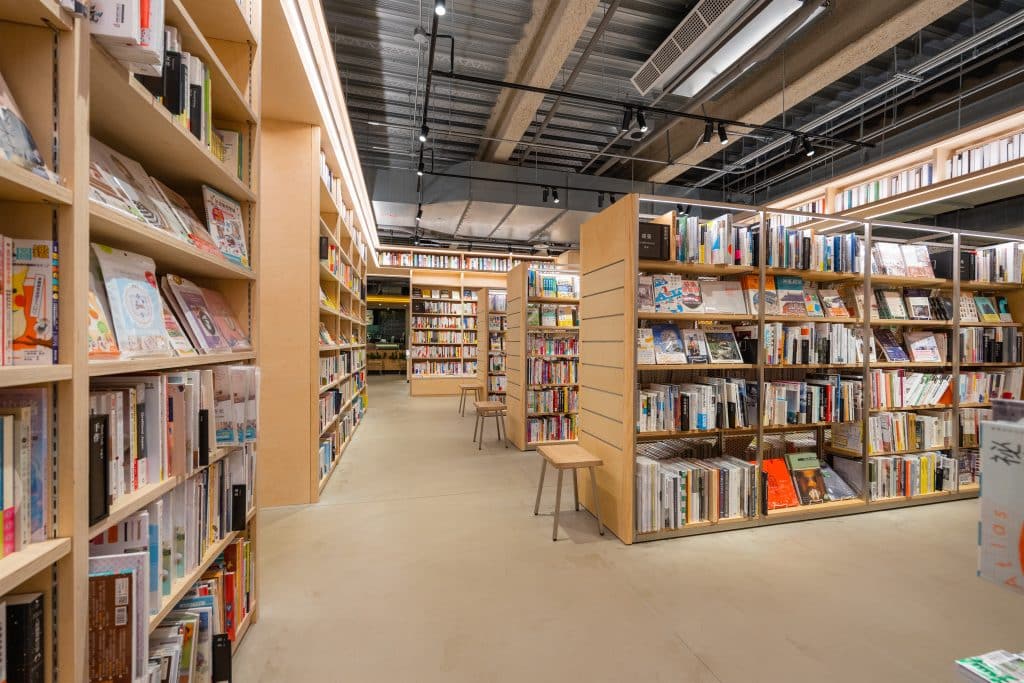 An image of a public library, showcasing multiple bookcases.