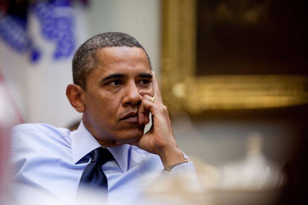 A picture of Barack Obama with his head resting in one hand.