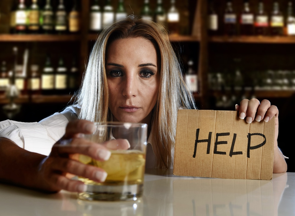 A woman asking for help at the bar