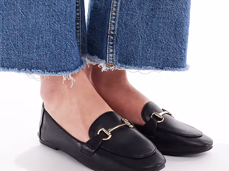 sleek black loafers with a buckle detail