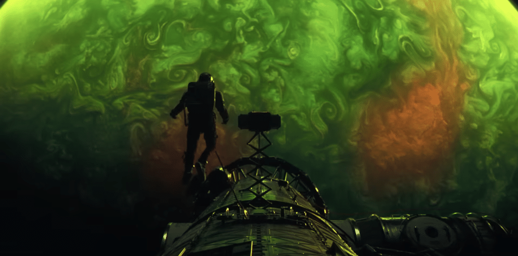 Screenshot of Ryan Gosling as Ryland Grace looking at the planet, Adrian.