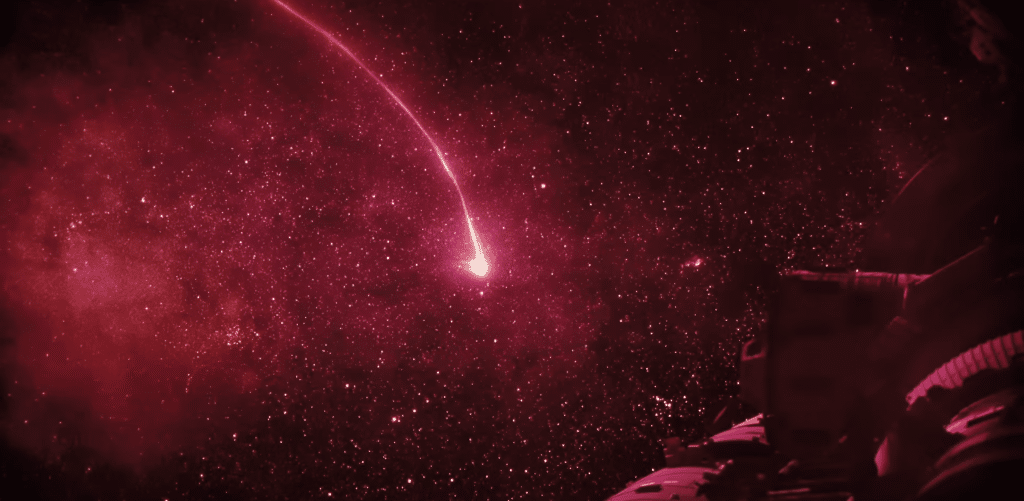 Screenshot of bright red Astrophage outside of spaceship in Project Hail Mary