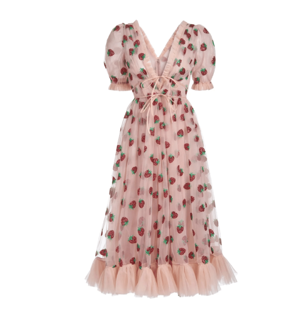 Strawberry dress designed by Lirkia Matoshi. A light pink midi dress with a glittery strawberry pattern.