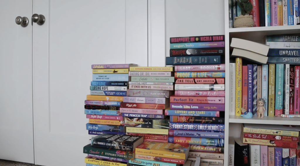 Various books displayed next to a bookshelf