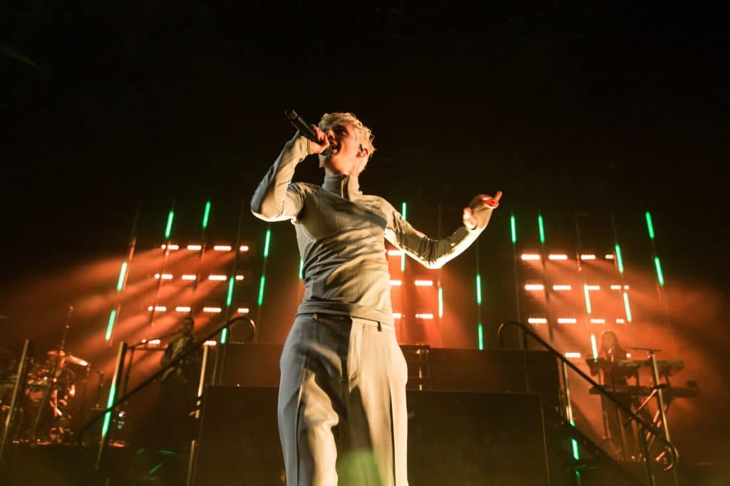 Australian singer Troye Sivan performing on stage in Vancouver, Canada in 2018.