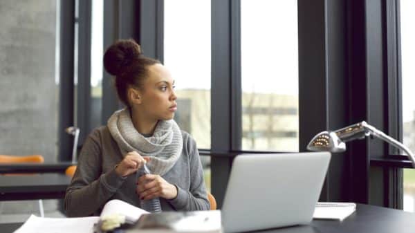 Woman struggling to completer her homework