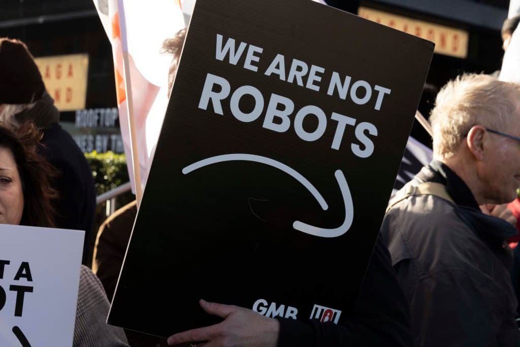Sign during protest outside of Amazon headquarters in London, UK fighting for the workforce and against AI
