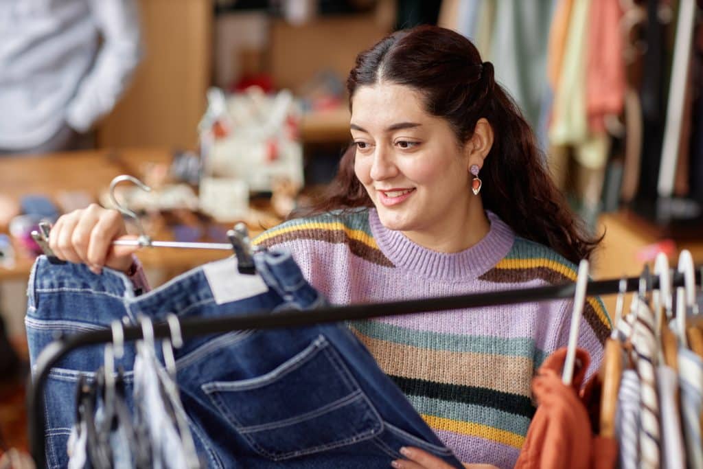 Young women browsing at a thrift store. (