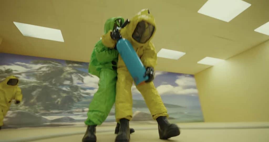 Photo of three individuals wearing hazmat suits in The Backrooms.