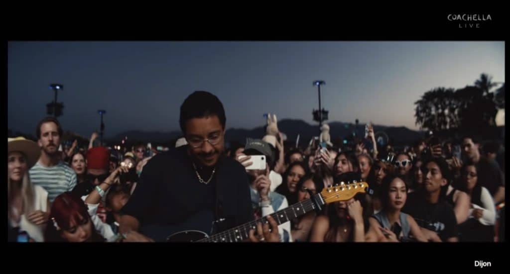 Dijon stands in front of fans and performs "Rodeo Clown" at Coachella music festival.