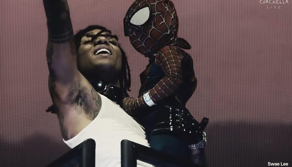 Swae Lee performs "Sunflower" with his son dressed as Spiderman at Coachella music festival.