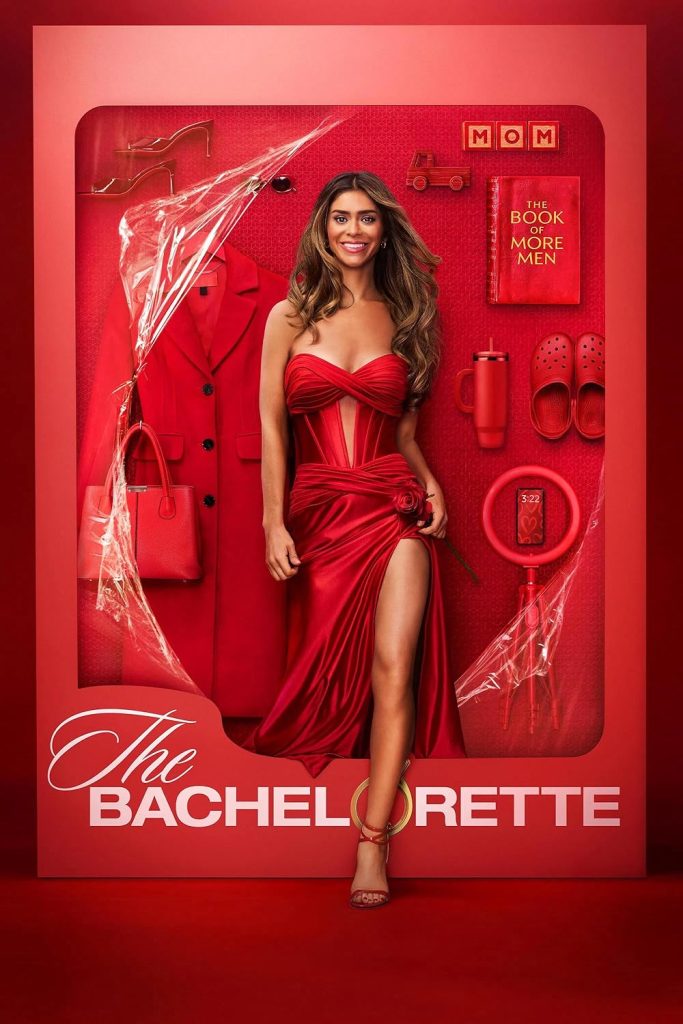 Taylor Frankie Paul in a red dress stepping outside of a "Barbie" styled box labeled "The Bachelorette." Inside the red-themed box, there are shoes, blocks that read "MOM" and a book titled "The Book of More Men."