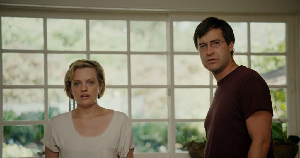 Elisabeth Moss as Sophie and Mark Duplass as Ethan both staring at something in shock in "The One I Love." Courtesy of IMDb.