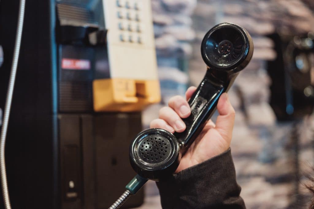 Person holding a payphone, 2000s life