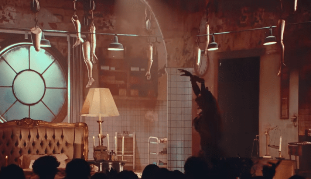 Martinez featuring an unsettling background to fit the theme of "WEIGHT WATCHERS." (Photo Credit: YouTube/Melanie Martinez)