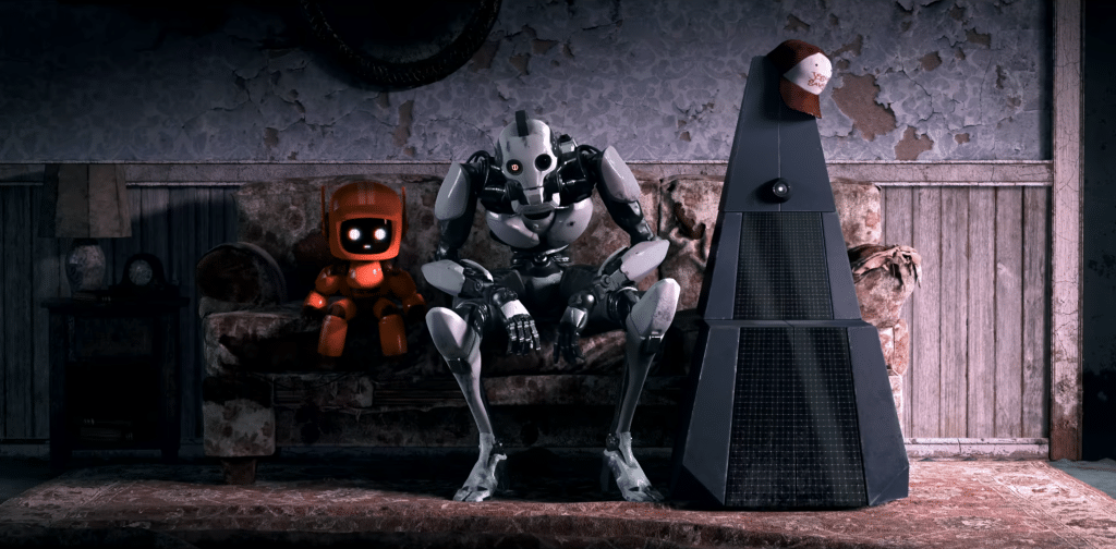 K-VRC, XBOT 4000, and 11-45-G (left to right) sitting on a coach (Credit: Netflix)