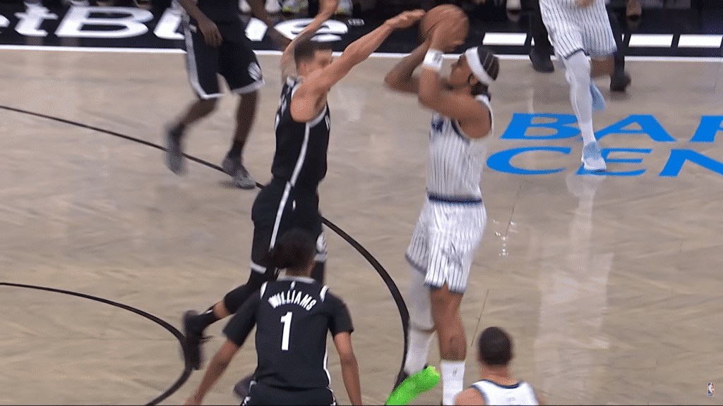 Paolo Banchero elevates for a three-pointer in rhythm