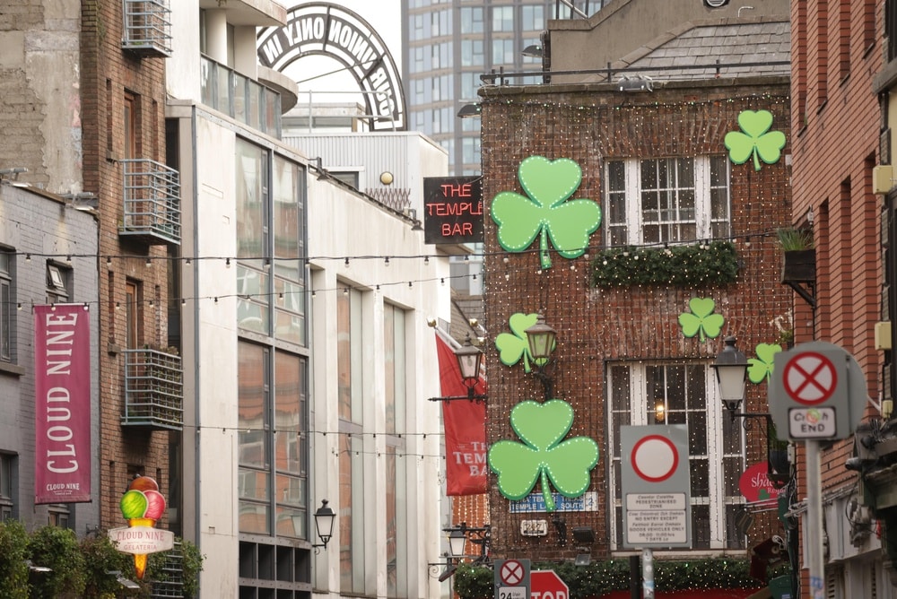The outside of a pub building decorated in shamrocks.