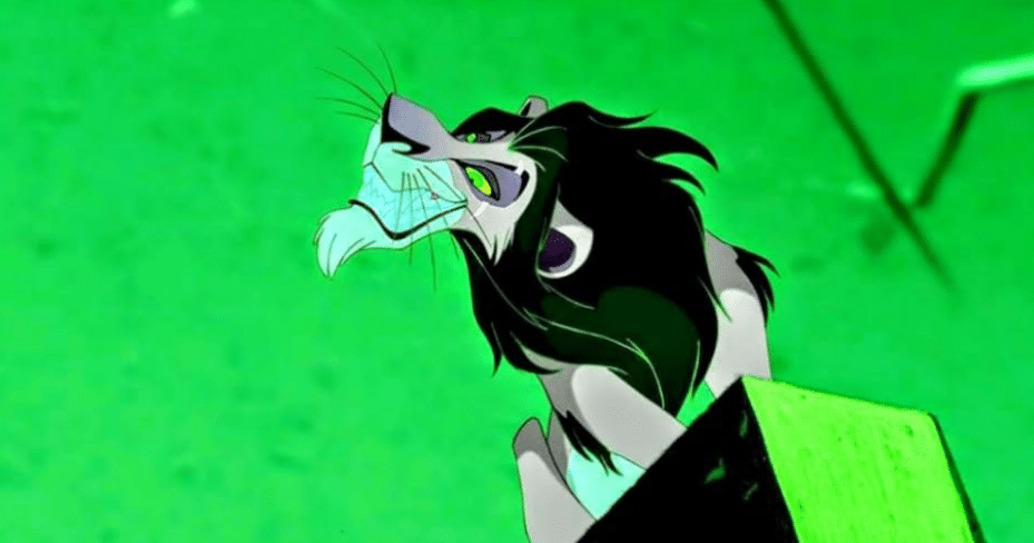 Image of Scar from the "Be Prepared" musical number, on a ledge against an odeous green background, with his head at an exaggerated angle, grinning with a mouth full of teeth down at the viewer. It projects power, and looks like a threat display.