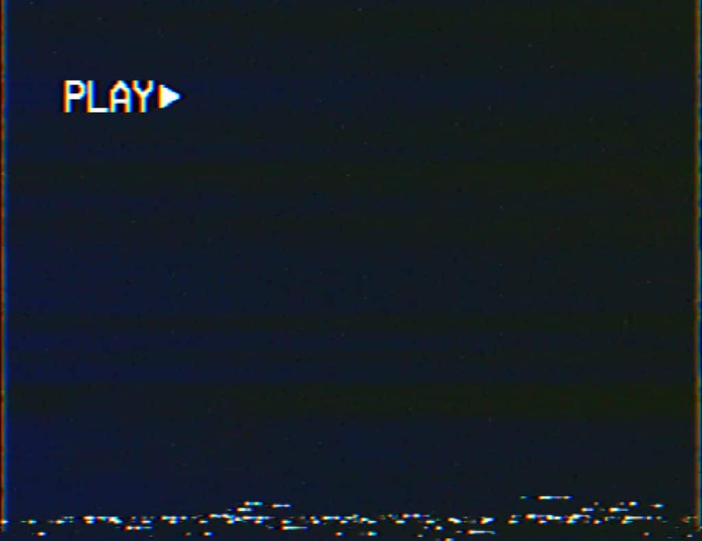 An image that mimiks what a VHS tape looks like before the movie begins when it is paused.