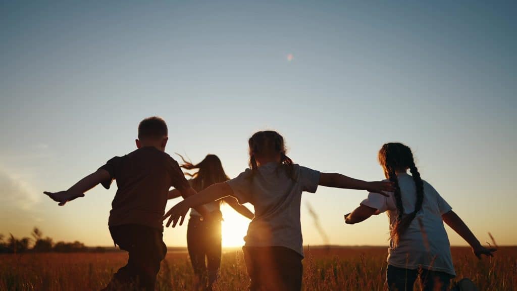 Children running in a field