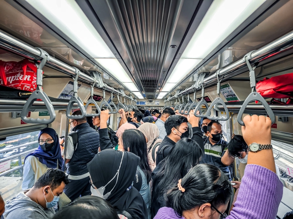 Commuters on a very busy train in Indonesia