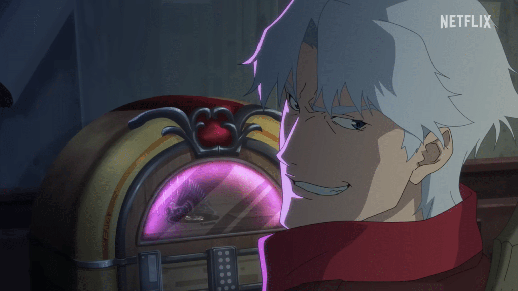 Dante smirking as he adjusts his old jukebox