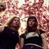 Members of Florence Road in front of a cherry blossom tree.