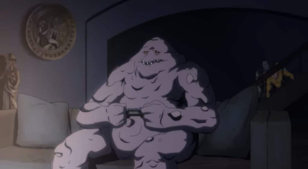 Clayface is sitting on a couch playing video games.