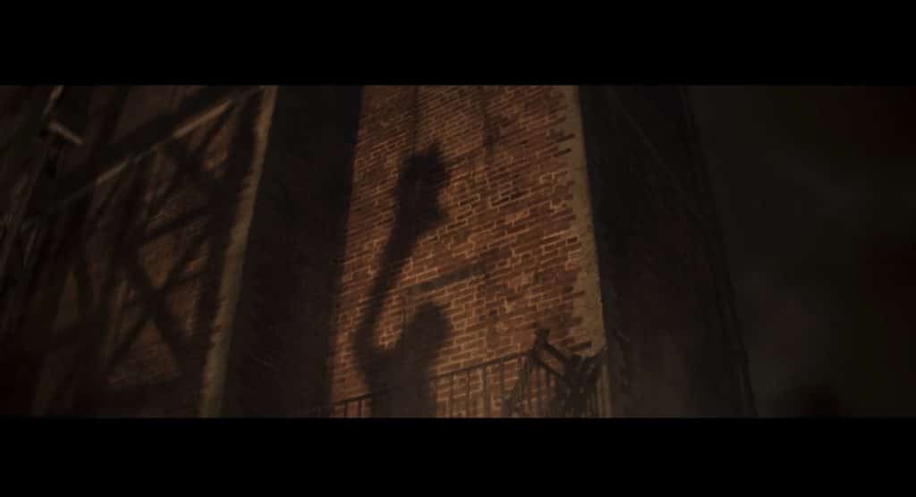 Clayface’s shadow is depicted on a wall.