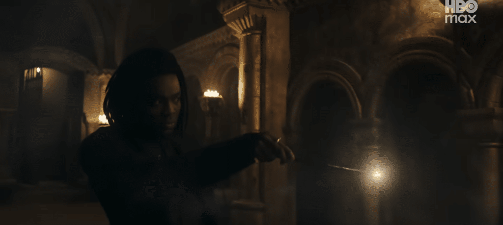 Snape turns a corner in Hogwarts with his wand ready for whatever he finds.