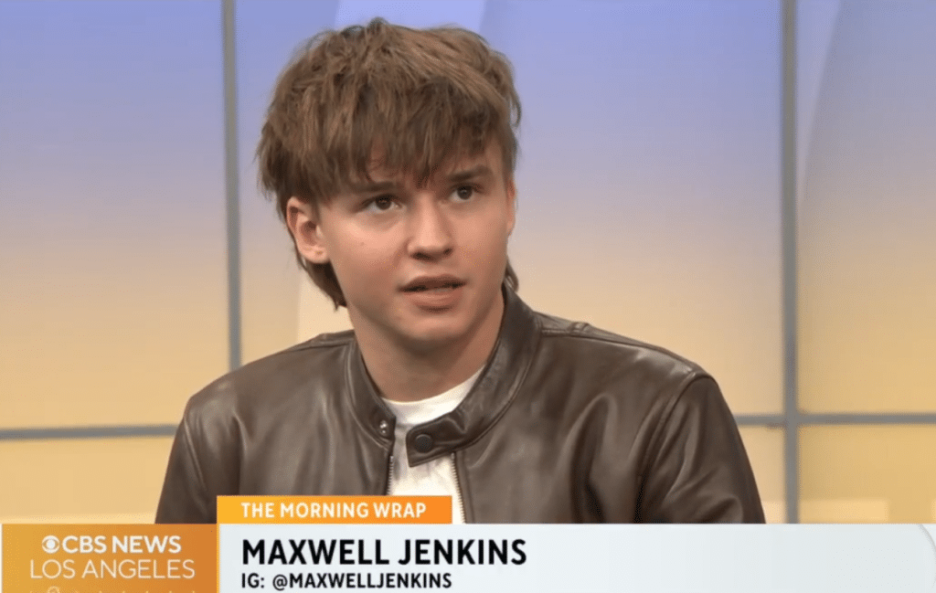 Maxwell Jenkins sits on stage to be interviewed by CBS News Los Angeles about his role in the movie Arcadian.