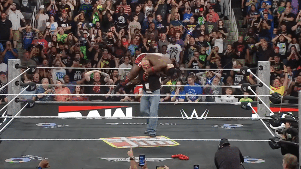 Brock Lesnar delivering an F5 to Oba Femi