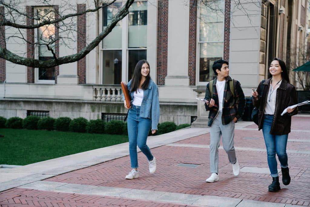 Three college students exploring campus.
