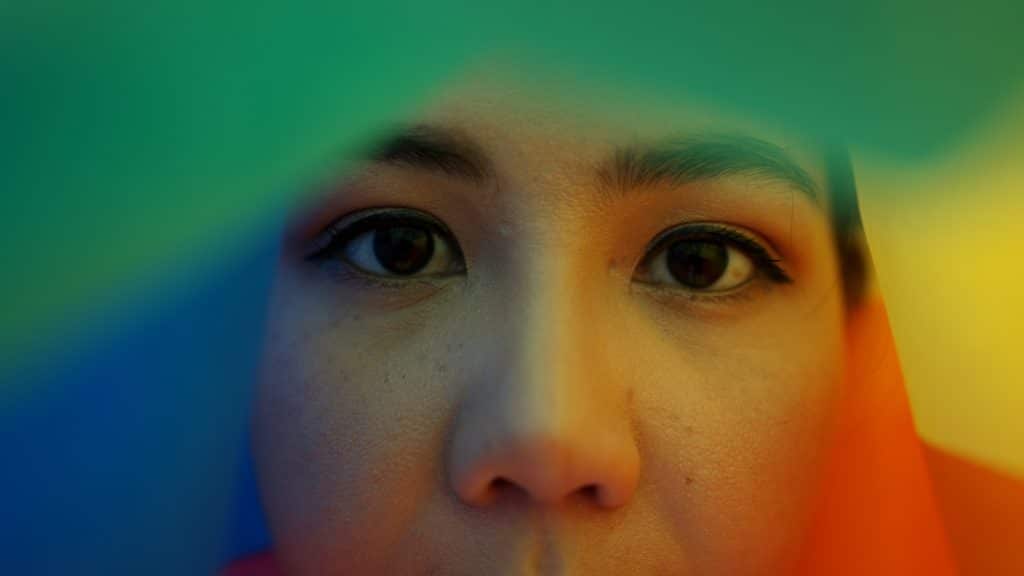 Woman with a colourful backdrop