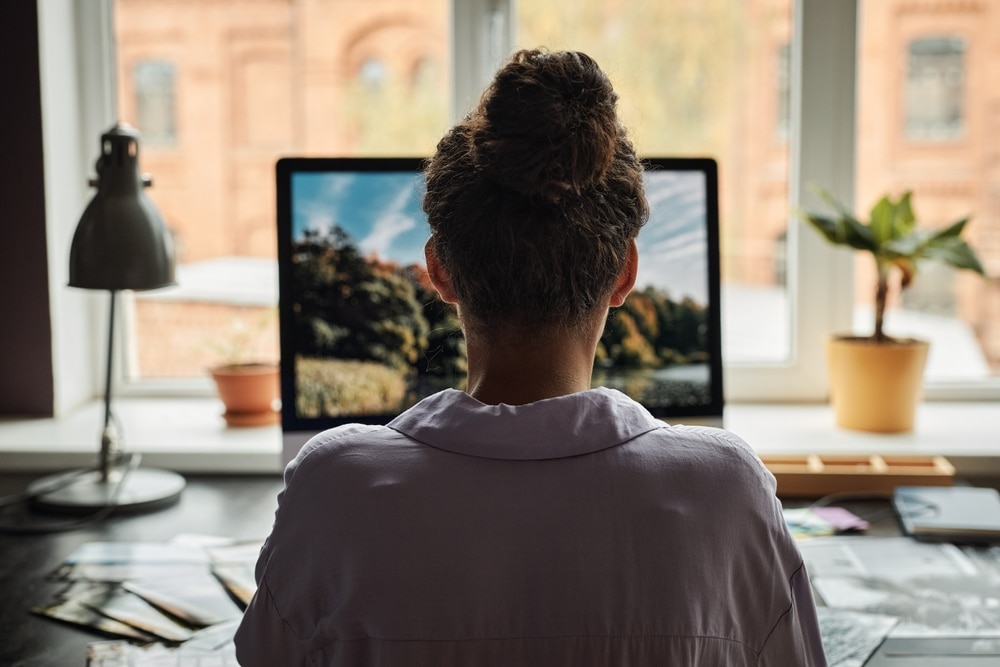 A girl looking at a computer screen