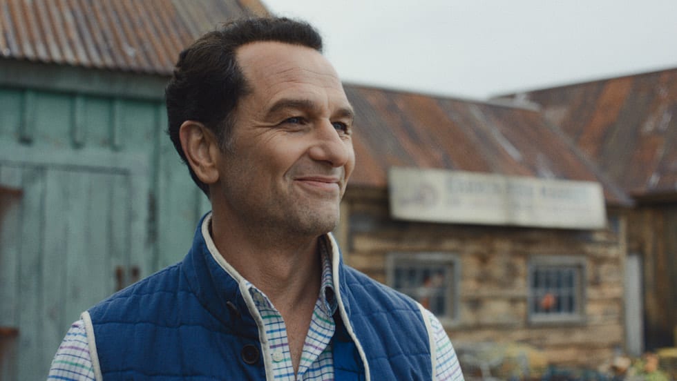 Matthew Rhys as Tom Loftis smiling