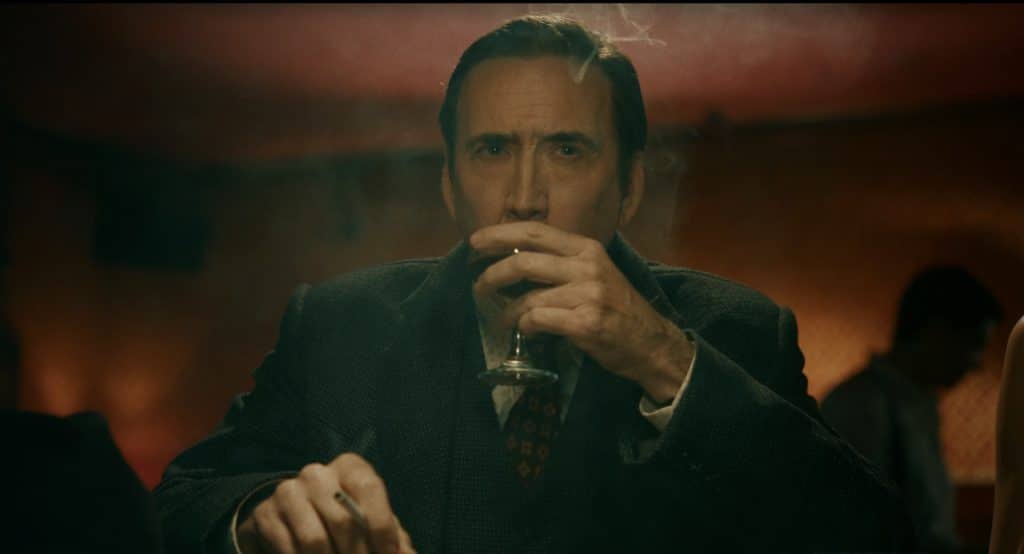 Ben Reilley is drinking alcohol and smoking in a nightclub.