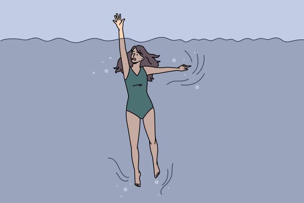 A figure reaching for the surface in the middle of a body of water