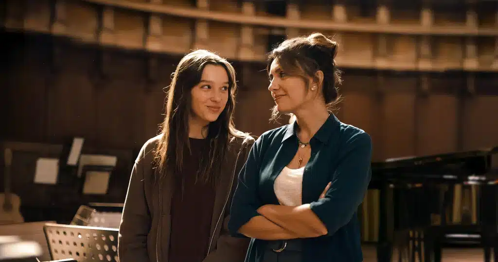 Sara Toscano and Serena Rossi smiling at each other in "Feel My Voice."