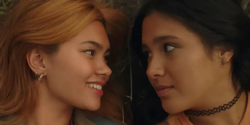 Myra Molloy and Maya da Costa laying down and facing each other in "Girls Like Girls."
