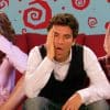 A collage of characters Carrie Bradshaw, Ted Mosby, and Rachel Green sitting on a couch.