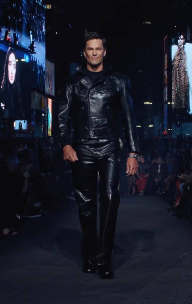 Football star Tom Brady walks down the Gucci runway in an all-leather fit reminiscent of Tom of Finland.