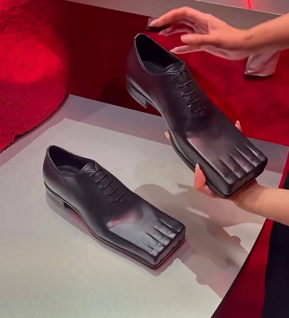 avant-garde dress shoes that have carved-out toes and a boxy look that makes them appear to be comically floppy. Almost like diving flippers.